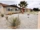 Charming single-story home with desert landscaping in front yard at 3021 E Shangri La Rd, Phoenix, AZ 85028