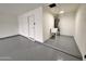 Spacious garage with sealed concrete floor, utility sink, and bright lighting at 3021 E Shangri La Rd, Phoenix, AZ 85028