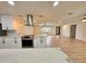 Bright and open kitchen with stainless steel vent hood and views of the living room at 3021 E Shangri La Rd, Phoenix, AZ 85028