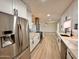 Modern kitchen showcasing stainless steel appliances, white cabinetry, and elegant countertops at 3021 E Shangri La Rd, Phoenix, AZ 85028