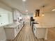 Modern kitchen with sleek white cabinets, stainless steel appliances, and stylish countertops at 3021 E Shangri La Rd, Phoenix, AZ 85028