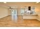 Open concept living room with wood flooring with open view of the kitchen and backyard at 3021 E Shangri La Rd, Phoenix, AZ 85028