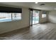 Bright living area with view of the pool and backyard through sliding glass doors at 3021 E Shangri La Rd, Phoenix, AZ 85028