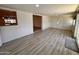 Inviting living room with stylish flooring, neutral walls, and sliding glass doors at 3021 E Shangri La Rd, Phoenix, AZ 85028