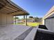 Spacious covered patio overlooking a backyard with artificial grass, pool, and storage shed at 3021 E Shangri La Rd, Phoenix, AZ 85028