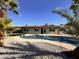 The backyard boasts a sparkling pool, rock landscaping, and well-maintained home at 3021 E Shangri La Rd, Phoenix, AZ 85028