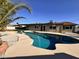 Backyard with a freeform pool, patio, and well-maintained home exterior at 3021 E Shangri La Rd, Phoenix, AZ 85028