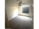 Inviting bedroom boasting neutral carpet, a ceiling fan, and a window with natural light at 3057 E Pinto Valley Rd, San Tan Valley, AZ 85143