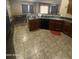 Spacious kitchen with dark countertops and an adjacent dining area perfect for gatherings at 3057 E Pinto Valley Rd, San Tan Valley, AZ 85143