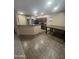 Open-concept kitchen featuring black appliances, eat-in nook and a large dining table at 3057 E Pinto Valley Rd, San Tan Valley, AZ 85143