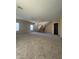 Spacious, bright living room with a ceiling fan, staircase and neutral carpet at 3057 E Pinto Valley Rd, San Tan Valley, AZ 85143