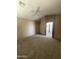 Carpeted main bedroom featuring neutral walls, and ensuite bathroom access at 3057 E Pinto Valley Rd, San Tan Valley, AZ 85143