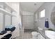 Modern bathroom with a tiled shower, floating shelves, sleek vanity, and contemporary fixtures at 3122 E Kristal Way, Phoenix, AZ 85050