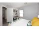Bright bedroom featuring a built-in desk, window, and light neutral walls for a serene feel at 3122 E Kristal Way, Phoenix, AZ 85050