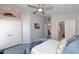 Bright bedroom with ceiling fan, double closets, bathroom access, and comfortable modern decor at 3122 E Kristal Way, Phoenix, AZ 85050