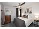 Comfortable bedroom with ceiling fan, stylish decor, and ample natural light from the window at 3122 E Kristal Way, Phoenix, AZ 85050