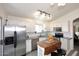 Modern kitchen featuring stainless steel appliances, a breakfast island, and white cabinets at 3122 E Kristal Way, Phoenix, AZ 85050