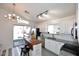 Bright and airy kitchen with white cabinetry, gray countertops, and a breakfast nook at 3122 E Kristal Way, Phoenix, AZ 85050