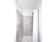 Shower with gray tiled walls and a white shower curtain at 3122 E Kristal Way, Phoenix, AZ 85050