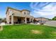 Spacious backyard with a covered patio, lush lawn, and a sparkling pool, ideal for outdoor living at 3644 E Del Rio St, Gilbert, AZ 85295