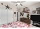 Comfortable bedroom with bed, closet, gun-themed decorations, dresser and TV at 3644 E Del Rio St, Gilbert, AZ 85295