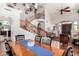 Open-concept dining area with hardwood floors and views of the home's staircase at 3644 E Del Rio St, Gilbert, AZ 85295