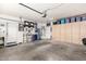 Spacious two-car garage featuring ample storage cabinets, providing organization and functionality at 3644 E Del Rio St, Gilbert, AZ 85295