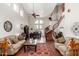 Bright living room with vaulted ceilings, hardwood floors, and a stunning curved staircase at 3644 E Del Rio St, Gilbert, AZ 85295