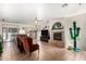 Inviting living room with cozy fireplace, tile floors and abundant natural light at 3644 E Del Rio St, Gilbert, AZ 85295
