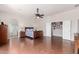 Well-lit main bedroom with hardwood floors, large bed, ensuite bathroom, and a walk-in closet at 3644 E Del Rio St, Gilbert, AZ 85295