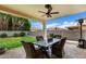 Covered patio featuring a ceiling fan, outdoor furniture, and a view of the well-maintained backyard at 3644 E Del Rio St, Gilbert, AZ 85295