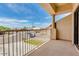 A wide patio with stucco walls, pillars, and a railing overlooks the street and neighborhood at 3644 E Del Rio St, Gilbert, AZ 85295