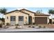 Charming single-story home featuring a two-car garage and beautiful desert landscaping at 4007 E Gold Mountain Ave, San Tan Valley, AZ 85143