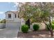 Charming two-story home featuring a well-manicured lawn and a welcoming entrance, enhancing its curb appeal at 4135 E Waterman Ct, Gilbert, AZ 85297