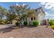 Well-maintained home exterior surrounded by lush landscaping, creating a serene and inviting atmosphere at 4135 E Waterman Ct, Gilbert, AZ 85297