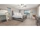 Bedroom featuring a comfortable bed, carpet, and natural light, creating a cozy and inviting retreat at 4135 E Waterman Ct, Gilbert, AZ 85297