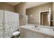 Clean and bright bathroom featuring a vanity with solid surface countertop and a shower and tub combo at 41413 W James Ln, Maricopa, AZ 85138