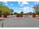 Community entrance gate with stone accents and wrought iron, providing security and curb appeal at 41413 W James Ln, Maricopa, AZ 85138