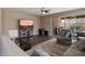 Living room featuring tile floors, backyard access and neutral paint at 41413 W James Ln, Maricopa, AZ 85138