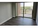 View of the bedroom with an access door to the balcony boasting cityscape and mountain views at 4750 N Central Ave # A10, Phoenix, AZ 85012