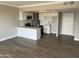 Open-concept kitchen features sleek cabinetry, modern appliances, and peninsula seating perfect for entertaining at 4750 N Central Ave # A10, Phoenix, AZ 85012