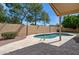 Private backyard pool with tiled patio and surrounding gravel for low maintenance at 5010 W Ivanhoe St, Chandler, AZ 85226