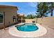 Home featuring a sparkling pool with tiled edges, adjacent to covered patio and grass at 5010 W Ivanhoe St, Chandler, AZ 85226