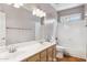 Beautiful bathroom boasts double sinks, generous vanity space, and a shower and tub combo for relaxation at 5010 W Ivanhoe St, Chandler, AZ 85226