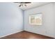 This bedroom offers a comfortable retreat with its ceiling fan and a window offering natural light and views at 5010 W Ivanhoe St, Chandler, AZ 85226