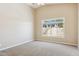 Bright primary bedroom features vaulted ceilings and an oversized window at 5010 W Ivanhoe St, Chandler, AZ 85226