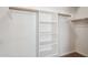 Spacious walk-in closet with custom shelving, providing ample storage space for your wardrobe and accessories at 5010 W Ivanhoe St, Chandler, AZ 85226