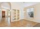 Dining room features built in shelving, neutral colors, and updated light fixture at 5010 W Ivanhoe St, Chandler, AZ 85226