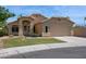 Charming single-story home with a two-car garage and a well-maintained lawn at 5010 W Ivanhoe St, Chandler, AZ 85226
