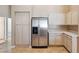 Bright kitchen features stainless steel refrigerator and tile floors at 5010 W Ivanhoe St, Chandler, AZ 85226